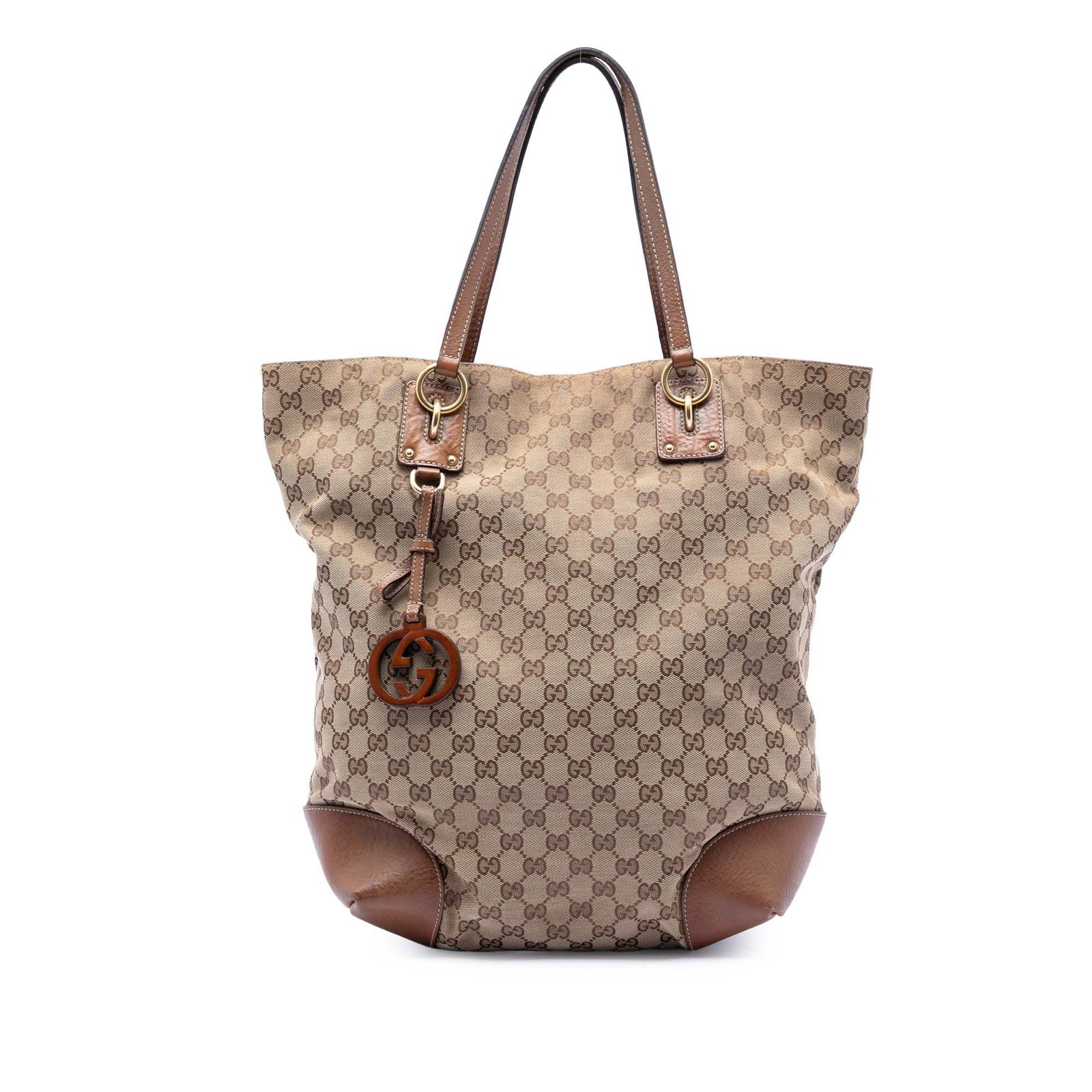 Gucci GG Canvas Tote Bag with Leather Trim and GG Charm: Gucci GG Canvas Tote Bag with Leather Trim and GG Charm This Gucci Large GG Canvas GG Charm Tote features a canvas body with leather trim, a GG charm, flat leather handles, an open top with a magnetic