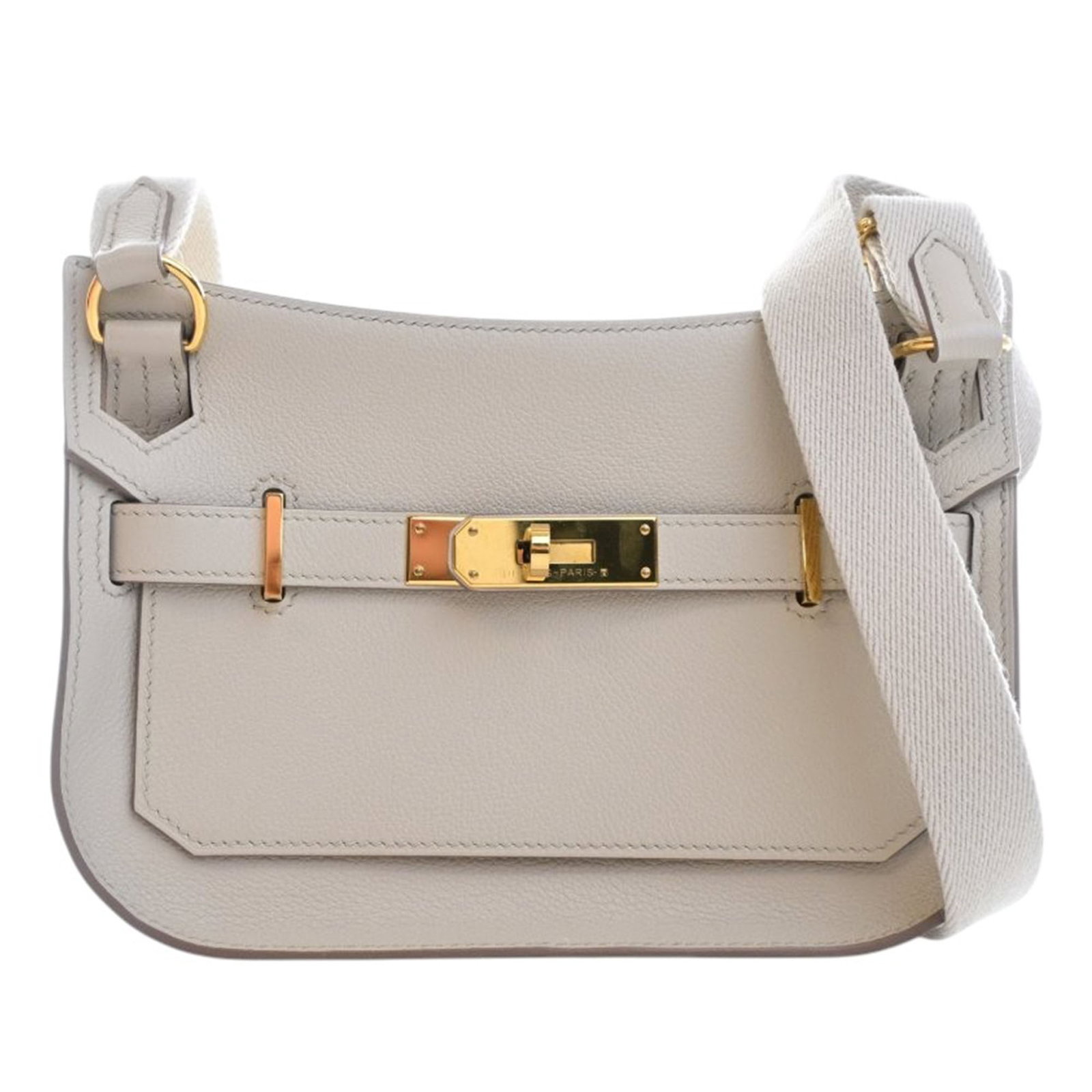 Hermes Mini Jypsiere Evercolor Leather Gray Bag: Hermes Mini Jypsiere Evercolor Leather Gray Bag This Hermes Mini Evercolor Jypsiere features a Beton-colored Evercolor leather body with a flat canvas strap. The bag is designed with a front flap secu