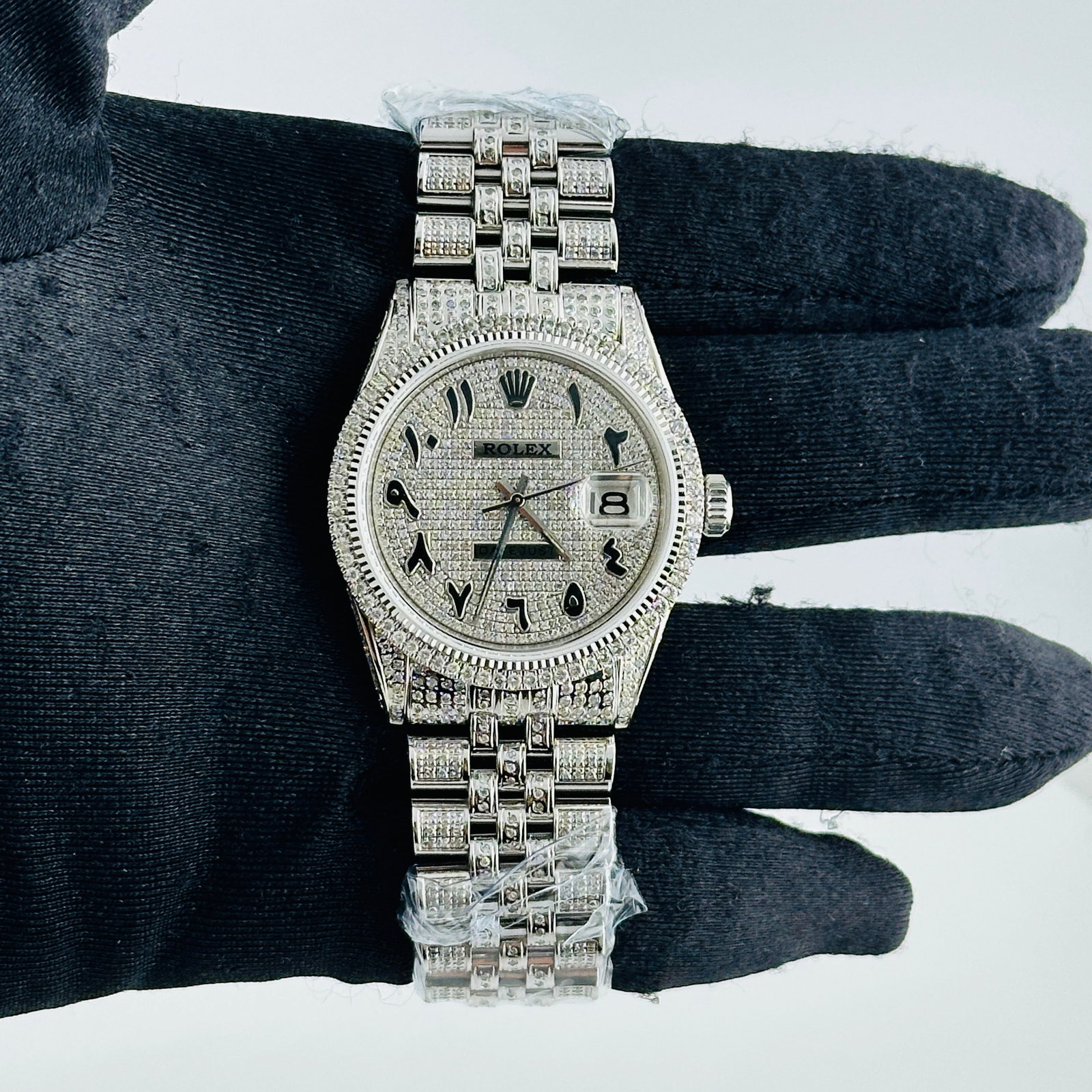Rolex Datejust Ref 1601 Mens Watch Diamond Arabic Dial Prong Bezel Jubilee Bracelet: Rolex Datejust Ref 1601 Mens Watch Diamond Arabic Dial Prong Bezel Jubilee Bracelet This Rolex Datejust features a diamond Arabic dial and a prong diamond bezel, complemented by an aftermarket Jubilee