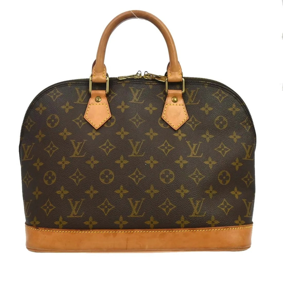 Louis Vuitton Alma Handbag in Brown Monogram Canvas: Louis Vuitton Alma Handbag in Brown Monogram Canvas Louis Vuitton Alma handbag in brown monogram canvas. This structured classic is made in France and is presented in good condition with visible wear.