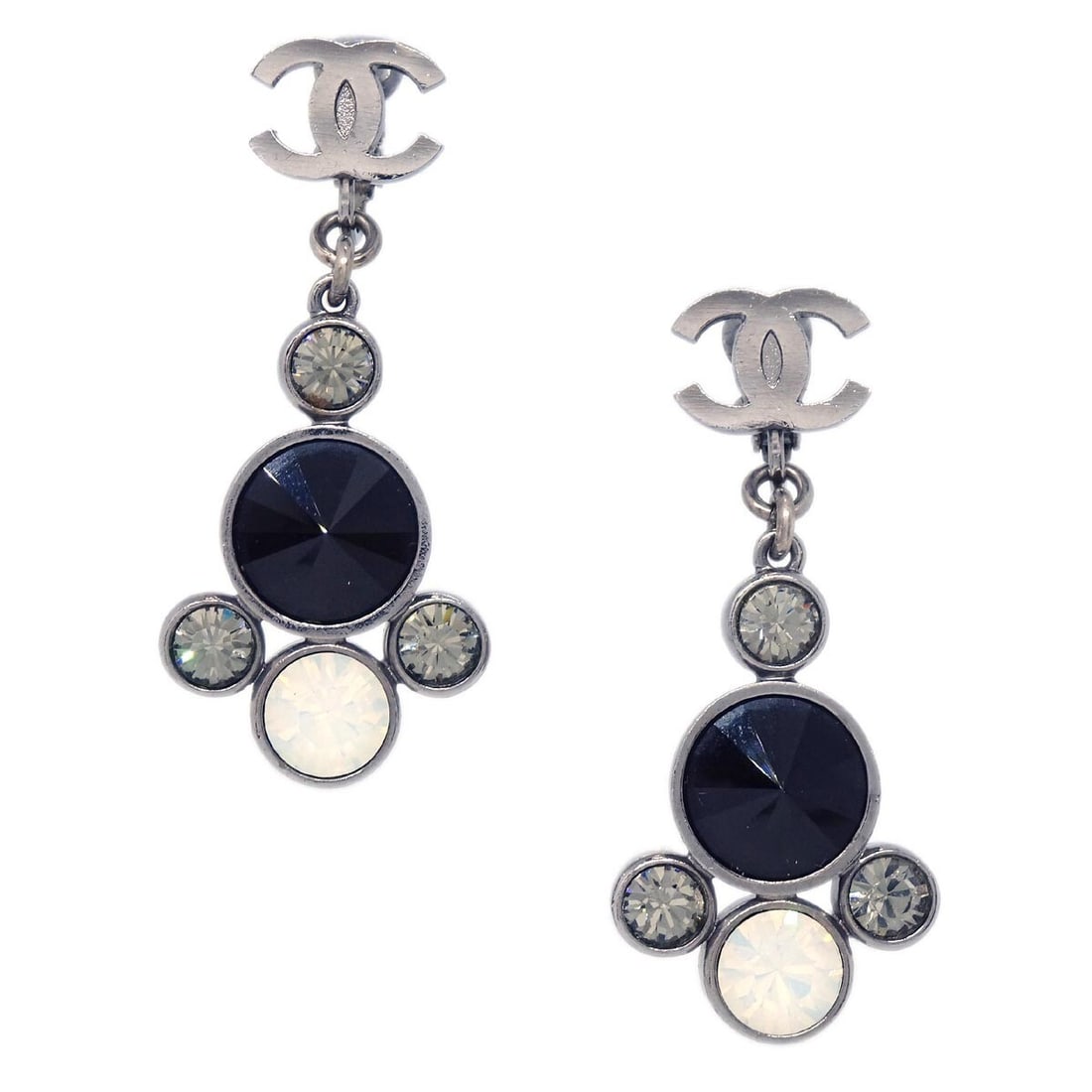 Chanel 06A CC Clip On Dangle Earrings Silver Plated Rhinestone: Chanel 06A CC Clip On Dangle Earrings Silver Plated Rhinestone Clip-on Chanel CC dangle earrings in silver-plated metal with rhinestone detailing. Made in France, this pair features the iconic logo de