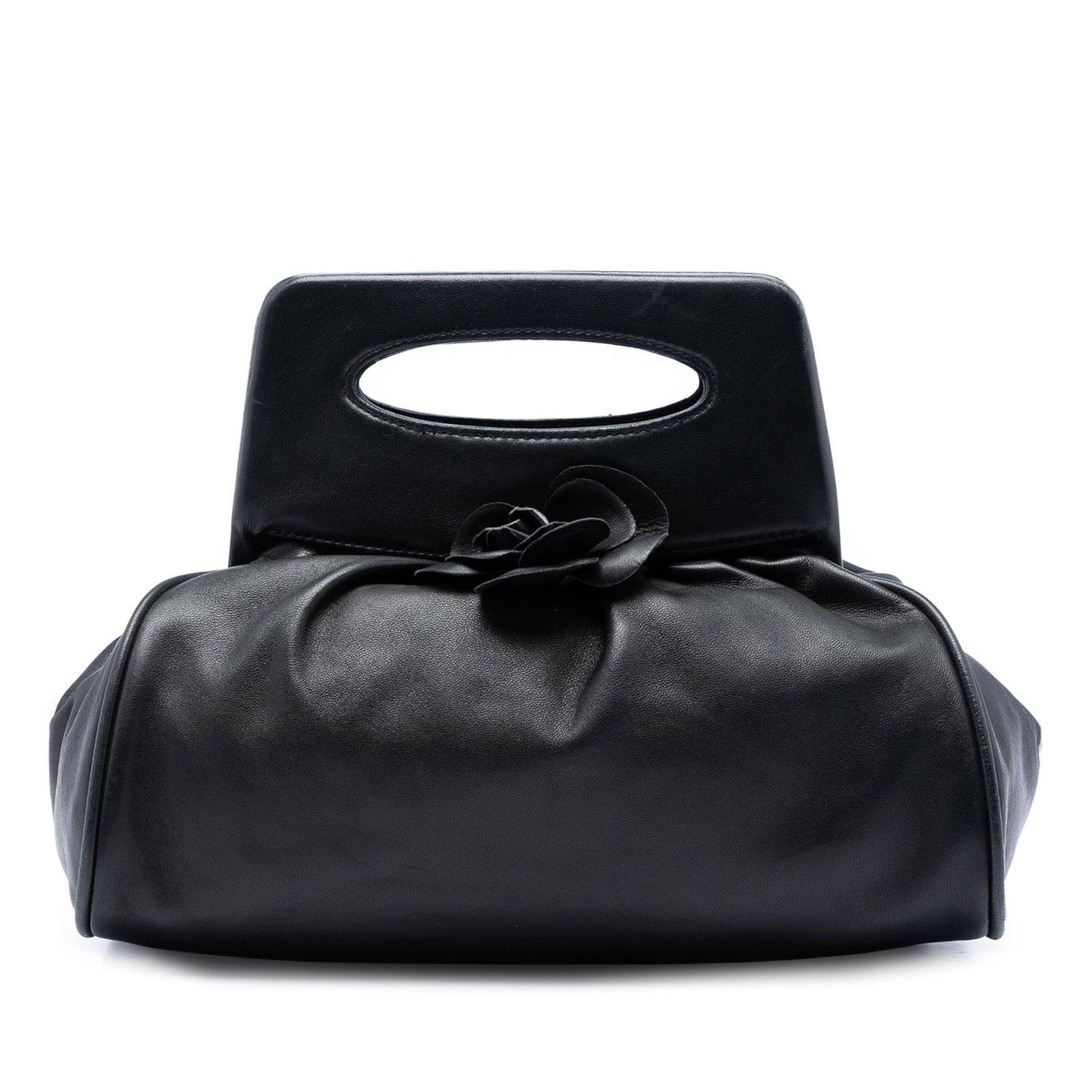 Chanel Camellia Top Handle Frame Bag in Black Lambskin: Chanel Camellia Top Handle Frame Bag in Black Lambskin Black Chanel Lambskin Camellia Top Handle Frame Bag crafted in lambskin leather with cutout leather handles, a top frame with snap closure, and a
