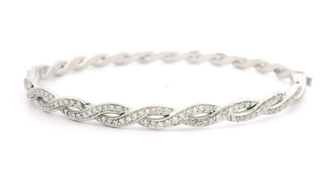 1ctw Diamond White Gold Braided Hinged Bangle Bracelet: 1ctw Diamond White Gold Braided Hinged Bangle Bracelet This exquisite White Gold Braided Stackable Hinged Open Bangle Bracelet features a stunning array of natural diamonds. Crafted from solid 17-18k 