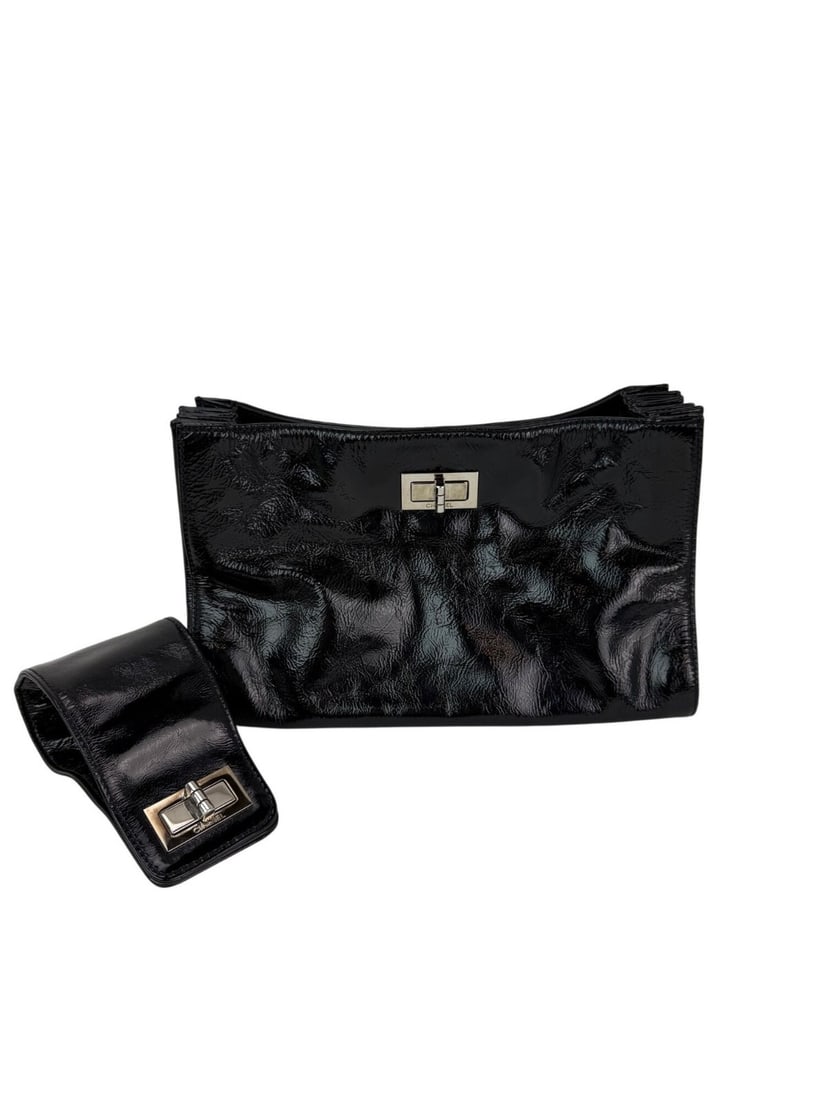 Chanel Patent Mademoiselle Black Convertible Clutch Bag: Chanel Patent Mademoiselle Black Convertible Clutch Bag Elevate your accessory collection with this stunning Chanel Patent Mademoiselle Lock Convertible Wrist Clutch in classic black. Crafted in Italy