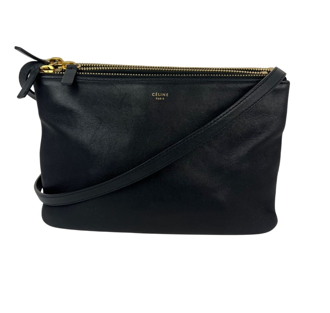 Celine Trio black lambskin convertible crossbody bag: Celine Trio black lambskin convertible crossbody bag This Celine Small Trio Crossbody Bag is crafted from smooth black lambskin leather and features a rectangular shape with a zip closure. The bag is 