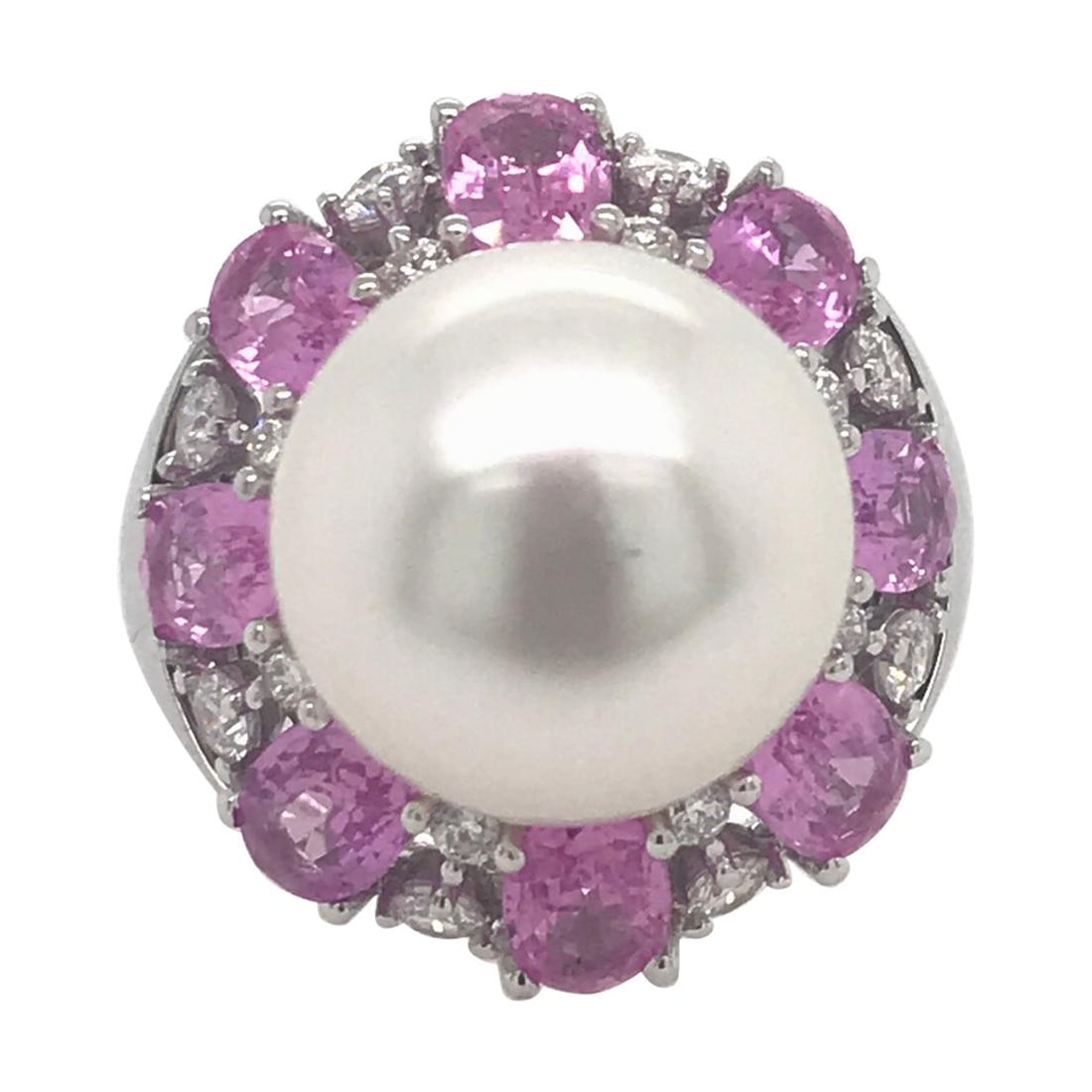 Harbor Diamonds 18K White Gold South Sea Pearl Pink Sapphire Ring 4.50 Carat: Harbor Diamonds 18K White Gold South Sea Pearl Pink Sapphire Ring 4.50 Carat This exquisite ring showcases a stunning white South Sea pearl measuring 13-14 mm at its center, elegantly flanked by vibra