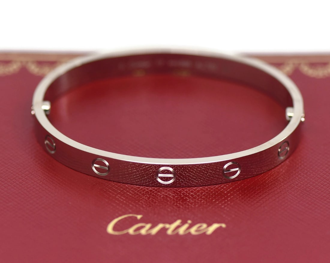 Cartier Love 18K White Gold Bangle Size 17: Cartier Love 18K White Gold Bangle Size 17 This Cartier Love bracelet is crafted from 18K white gold and features the iconic bangle style. Designed in the renowned Love collection, it comes in a size 
