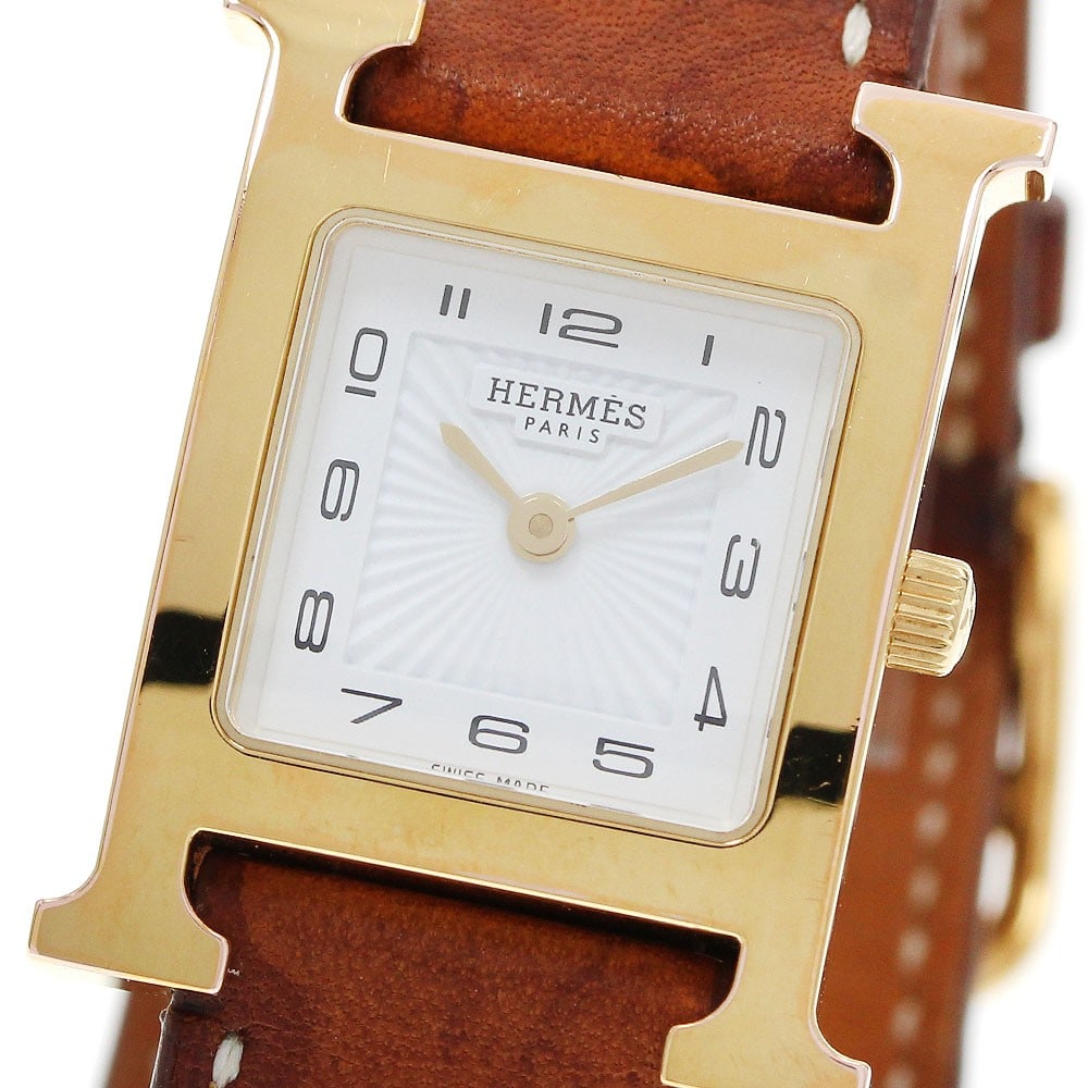 Hermes H-Watch HH1.201 womens quartz wristwatch double tour: Hermes H-Watch HH1.201 womens quartz wristwatch double tour Hermes H-Watch Double Tour quartz women's wristwatch, model HH1.201, made in Switzerland. It features a white dial, SS/GP case, leather belt