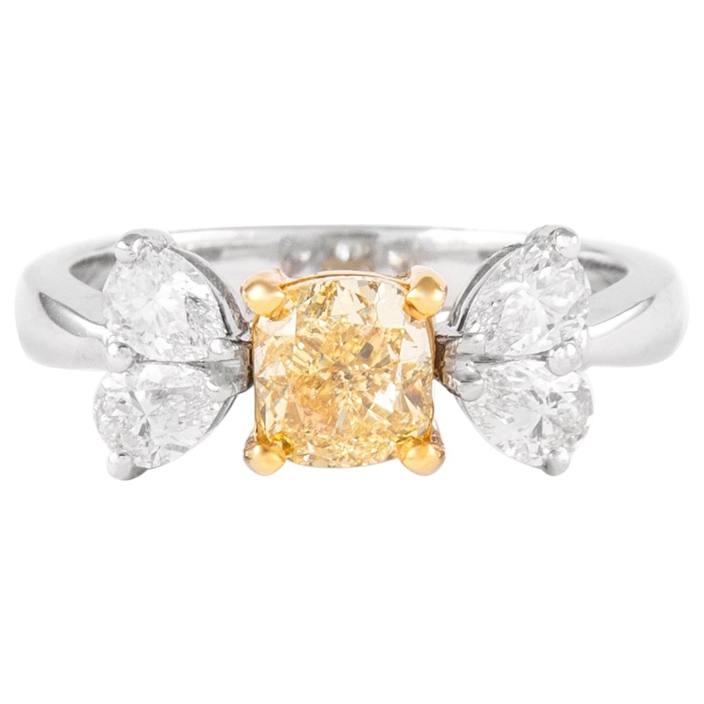 1.01ct Fancy Yellow Diamond Ring 18k Two Tone GIA Certified: 1.01ct Fancy Yellow Diamond Ring 18k Two Tone GIA Certified This stunning contemporary ring features a GIA certified 1.01 ct Fancy Yellow diamond at its center, cut in a beautiful cushion shape and gr
