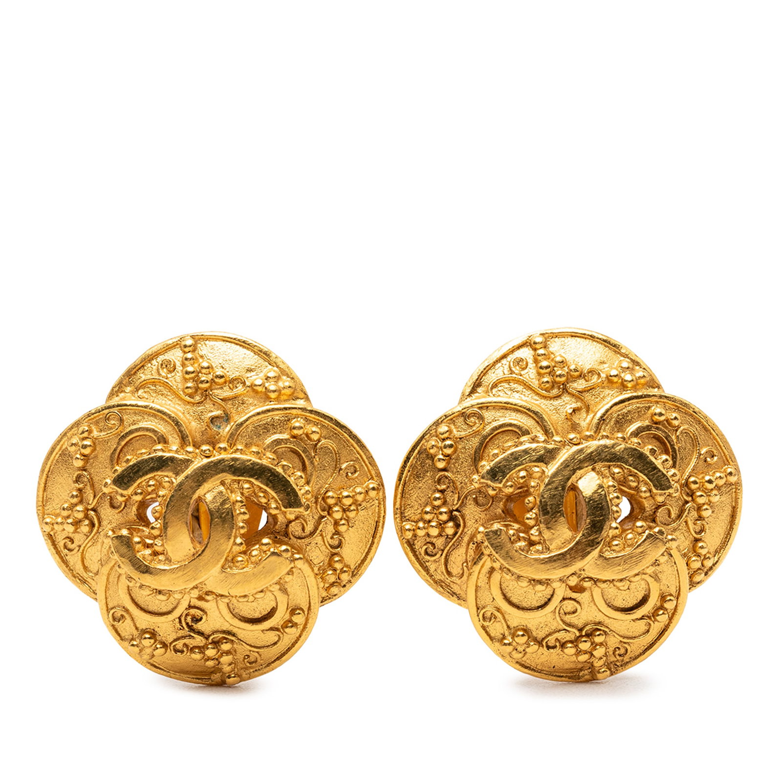 Chanel CC Clover Gold Plated Clip On Earrings: Chanel CC Clover Gold Plated Clip On Earrings These Chanel CC Gold Plated Clover Clip On Earrings feature gold-plated metal construction with a clover motif and clip-on closures. Made in France, these
