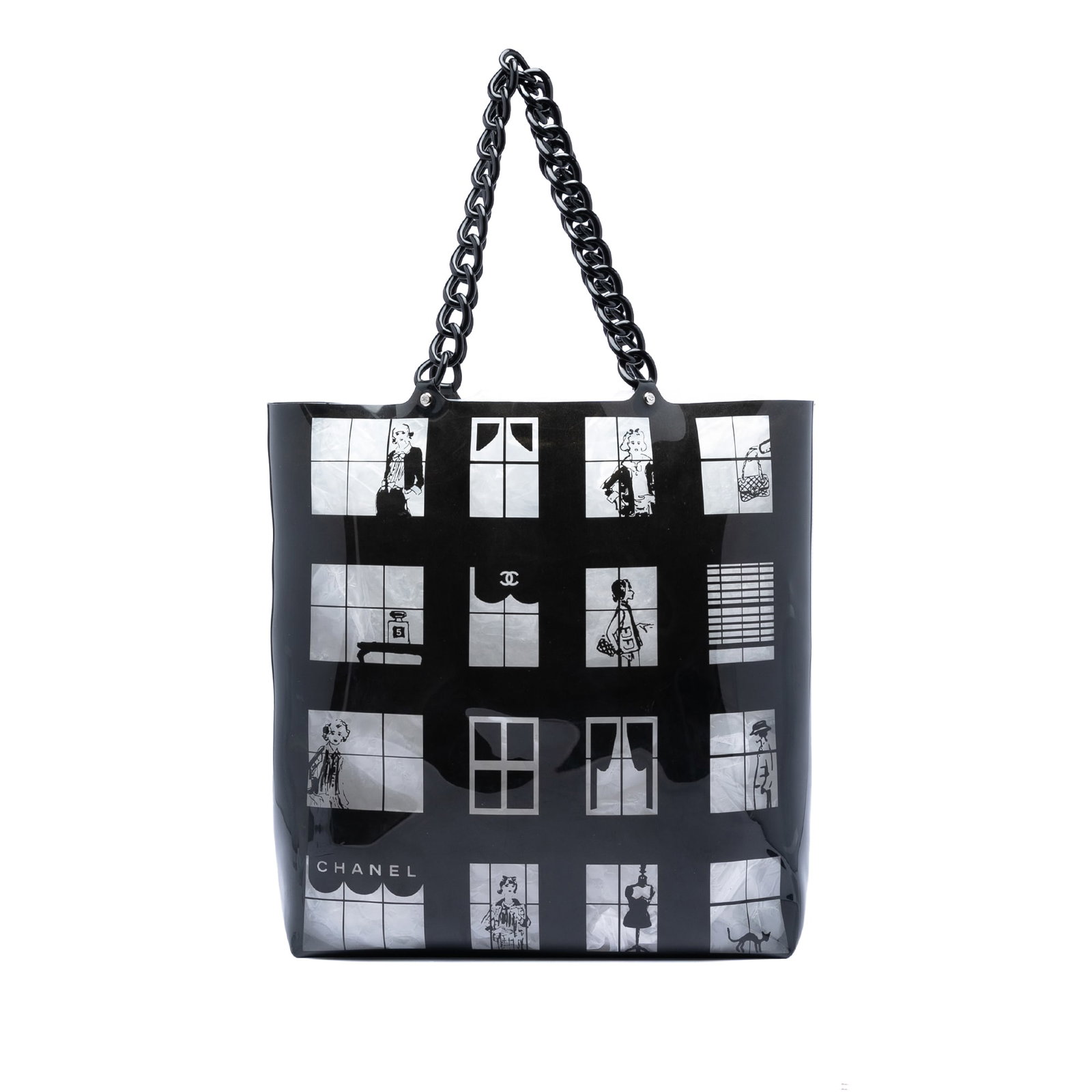 Chanel Vinyl Coco Window black tote bag: Chanel Vinyl Coco Window black tote bag This Chanel Vinyl Coco Window Tote features a printed vinyl body with resin chain-link straps and an open top. The bag is crafted in Italy and comes in a black 