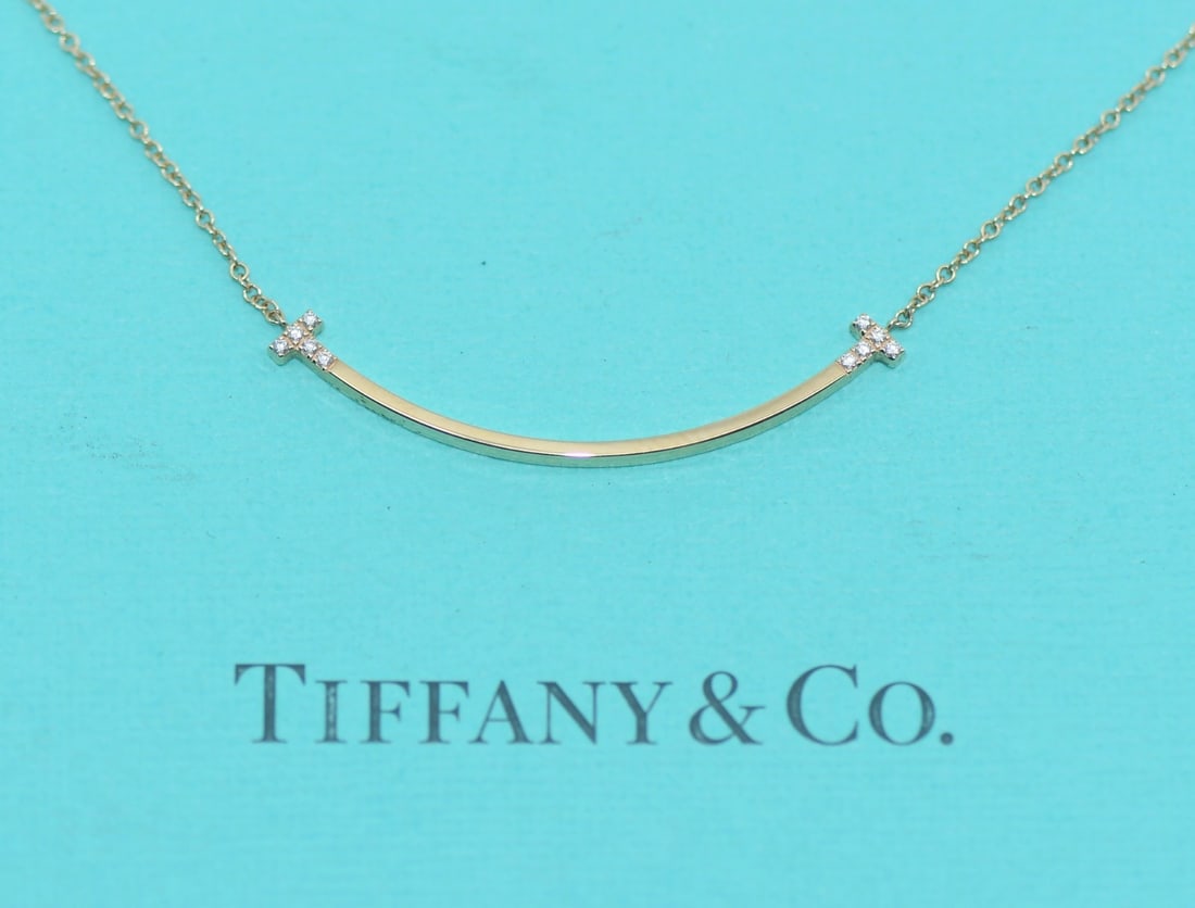 Tiffany & Co T Smile Small Diamond Rose Gold Pendant Necklace: Tiffany & Co T Smile Small Diamond Rose Gold Pendant Necklace This Tiffany & Co. T Smile Small Necklace features a delicate pendant crafted in 18k rose gold, adorned with diamonds. The necklace measur