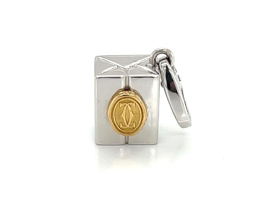 Cartier Double C Gift Box Charm Pendant in 18k Yellow and White Gold: Cartier Double C Gift Box Charm Pendant in 18k Yellow and White Gold A pre-owned Cartier Double C gift box charm pendant crafted in solid 18k yellow and white gold. This fine jewelry piece features Ca