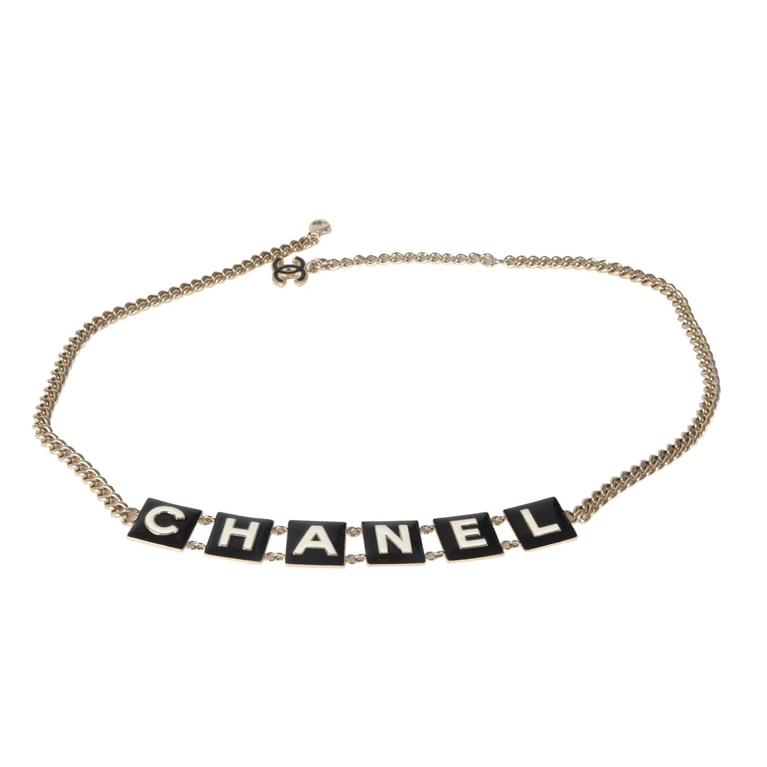 Chanel gold plated logo belt 31 in with pouch: Chanel gold plated logo belt 31 in with pouch This Chanel belt from the 2022 collection features a striking black and white enamel design with gold-plated metal and gold-tone hardware. Designed for a 