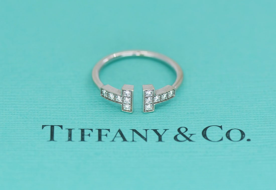 Tiffany & Co T Wire Diamond 18K White Gold Size 4.5 Ring: Tiffany & Co T Wire Diamond 18K White Gold Size 4.5 Ring This Tiffany & Co. T Wire ring features sparkling diamonds set in 18K white gold. Designed in the signature T Wire style, this elegant ring is 