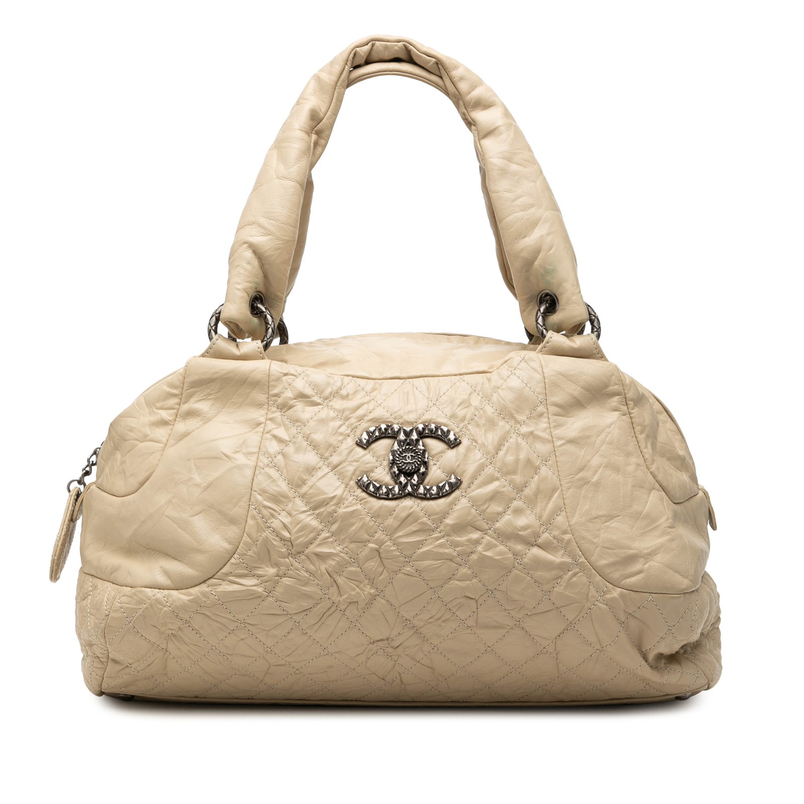 Chanel Coco Rider Bowling Bag in Beige Quilted Aged Calfskin: Chanel Coco Rider Bowling Bag in Beige Quilted Aged Calfskin This Chanel Coco Rider Bowling Bag is crafted from quilted aged calf leather in beige. It features flat leather handles, a top zip closure,