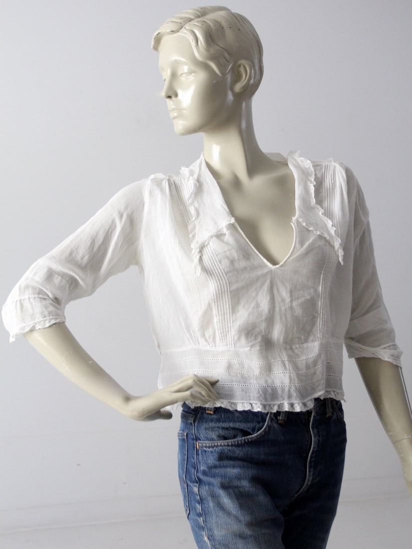 Early 20th Century Antique White Ruffle Blouse with Lace Trim: Early 20th Century Antique White Ruffle Blouse with Lace Trim Discover this exquisite antique white blouse from the early 20th century, a part of our Stylist's Collection. Crafted from delicate sheer 