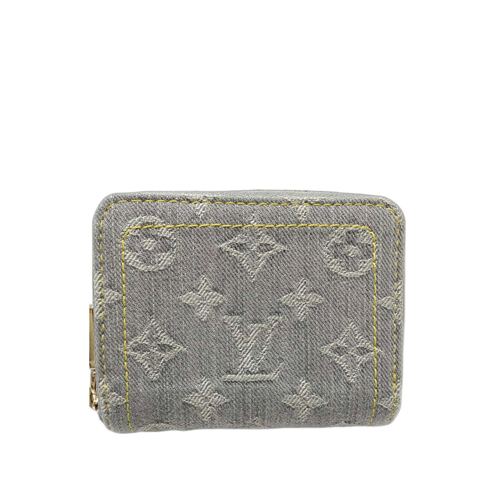 Louis Vuitton denim zip coin purse with slip compartments: Louis Vuitton denim zip coin purse with slip compartments This Louis Vuitton Monogram Denim Zippy Coin Purse features a monogram denim fabric body with a zip-around closure and interior slip compartme