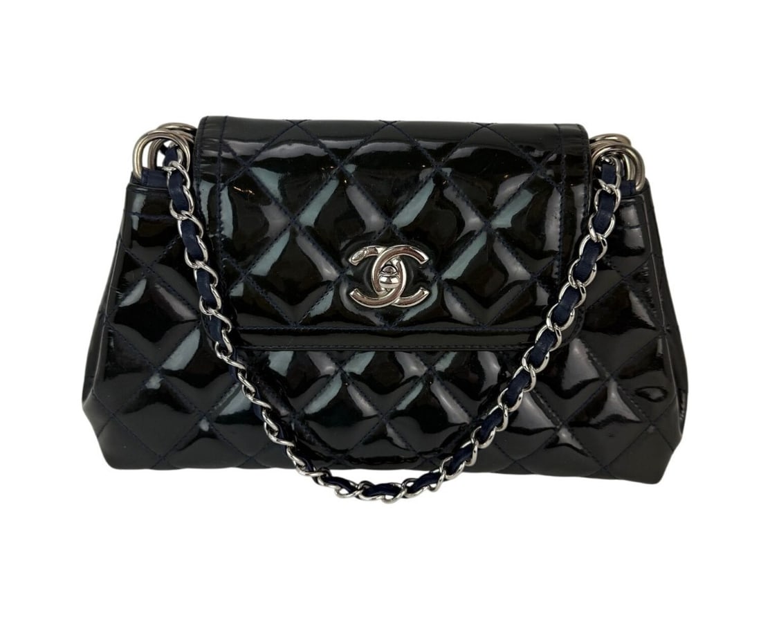 Chanel Coco Shine Medium Accordion Navy Patent Leather Flap Crossbody Bag: Chanel Coco Shine Medium Accordion Navy Patent Leather Flap Crossbody Bag This Chanel Medium Coco Shine Accordion Flap Bag is crafted from dark navy patent leather with a signature quilted finish. The
