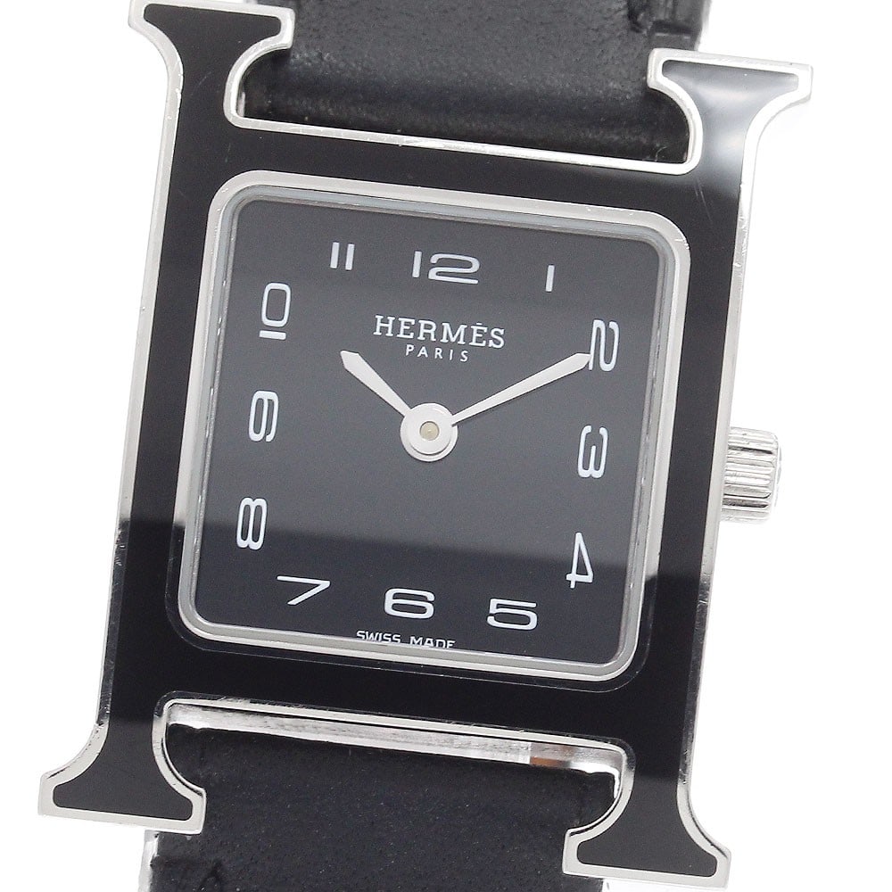 Hermes H Watch HH1.221 women's quartz wristwatch: Hermes H Watch HH1.221 women's quartz wristwatch HERMES H Watch women's quartz wristwatch, pre-owned and offered as watch only. It features a stainless steel case, leather strap, black dial, and Swiss