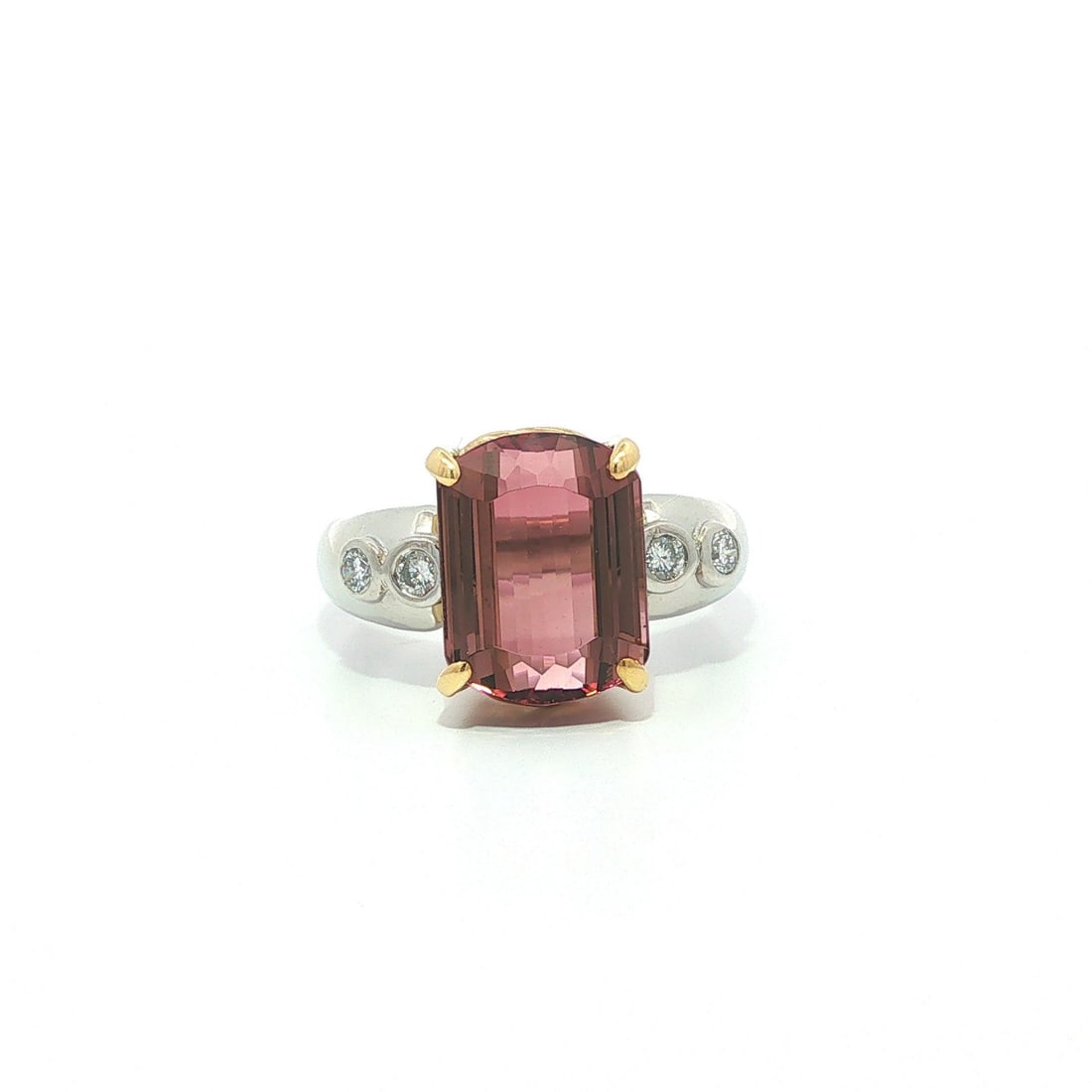 GIA Orangy Pink Tourmaline Diamond Ring in Platinum and 18k Gold 6.7ctw: GIA Orangy Pink Tourmaline Diamond Ring in Platinum and 18k Gold 6.7ctw Pre-owned cocktail ring featuring one natural genuine orangy pink tourmaline and four natural genuine diamonds. The tourmaline i