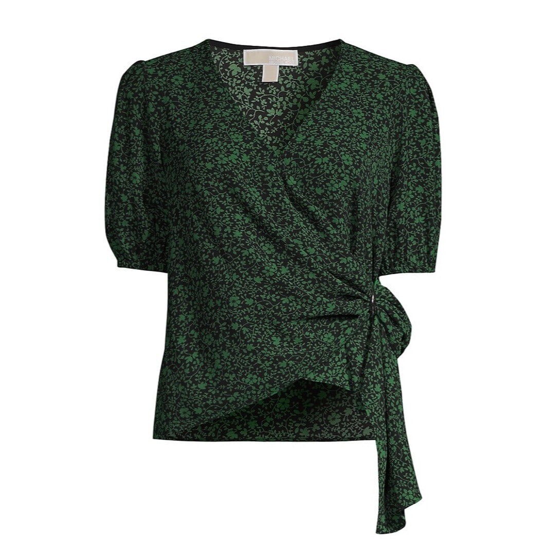 Michael Kors Green Printed Faux Wrap Blouse with Lace Hem: Michael Kors Green Printed Faux Wrap Blouse with Lace Hem Elevate your wardrobe with this stylish Printed Faux Wrap Top from Michael Michael Kors. Designed in a vibrant green hue, this blouse features