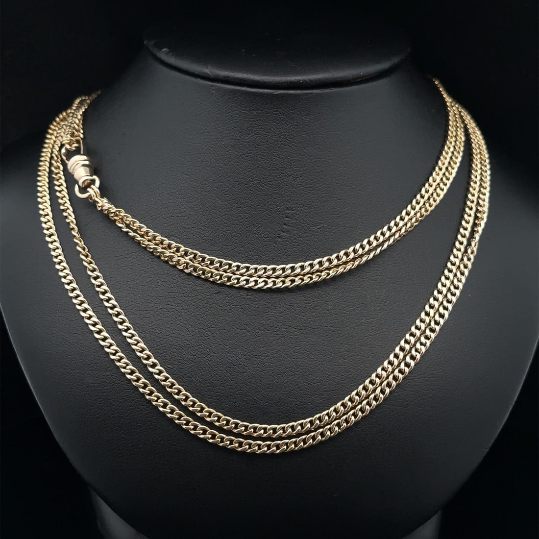 Antique 60 Inch Yellow Gold Curb Link Chain Necklace with Dog Clip Clasp: Antique 60 Inch Yellow Gold Curb Link Chain Necklace with Dog Clip Clasp This rare antique necklace features a 60-inch solid yellow gold curb link watch chain with a dog clip clasp. Crafted for unisex