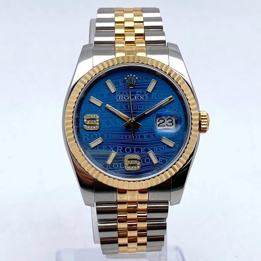 Blue Wave Dial Rolex Datejust 36 Diamond Markers 18K Gold Steel 116233 Watch: Blue Wave Dial Rolex Datejust 36 Diamond Markers 18K Gold Steel 116233 Watch This Rolex Datejust 36 wristwatch features a rare factory blue wave Jubilee dial adorned with diamond hour markers. The wat