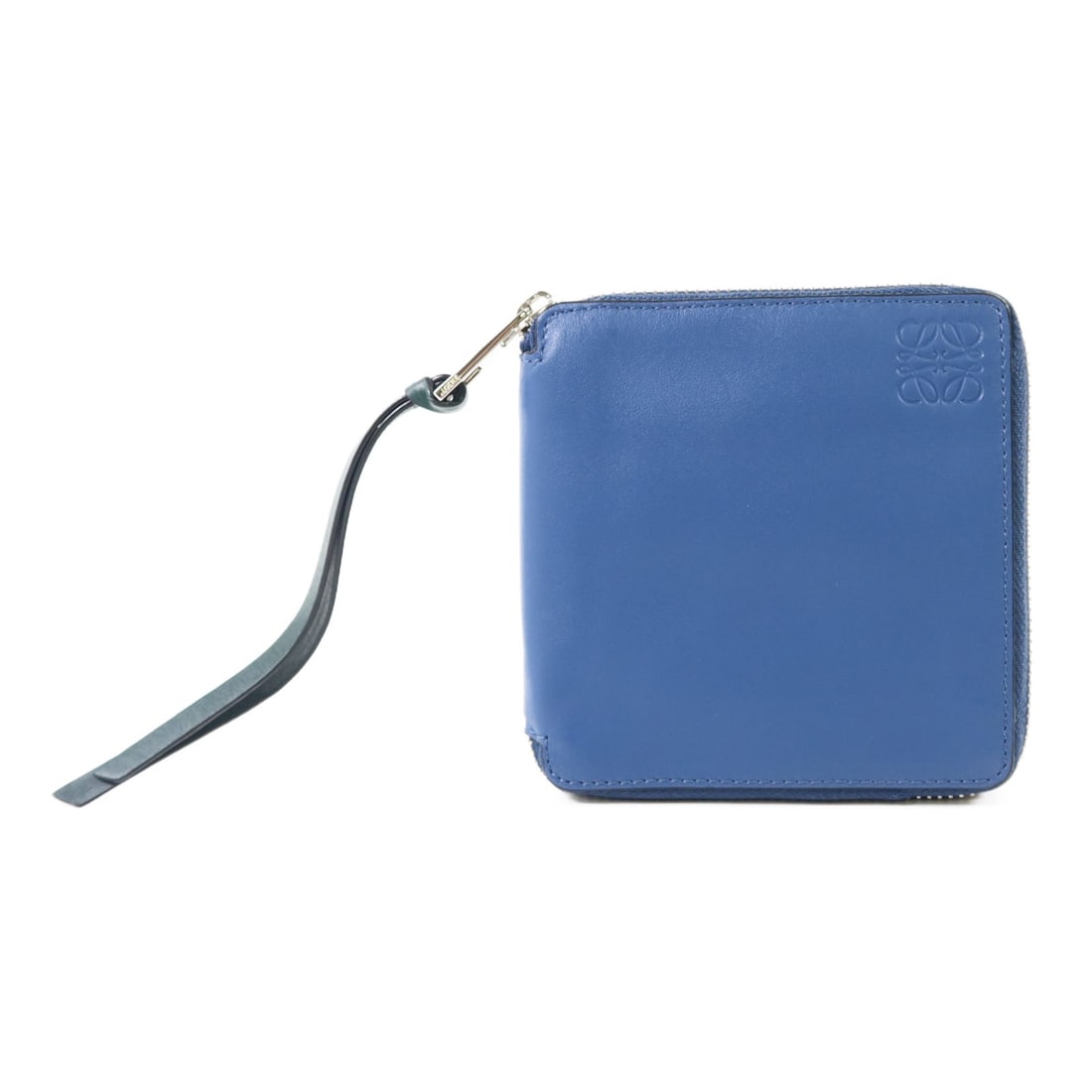 Blue Calfskin Zip Wallet LOEWE Round SHW: Blue Calfskin Zip Wallet LOEWE Round SHW A LOEWE round wallet in blue calfskin leather with a compact zip-fastened design. It features four card slots, one button pocket, and one open pocket. Accessor