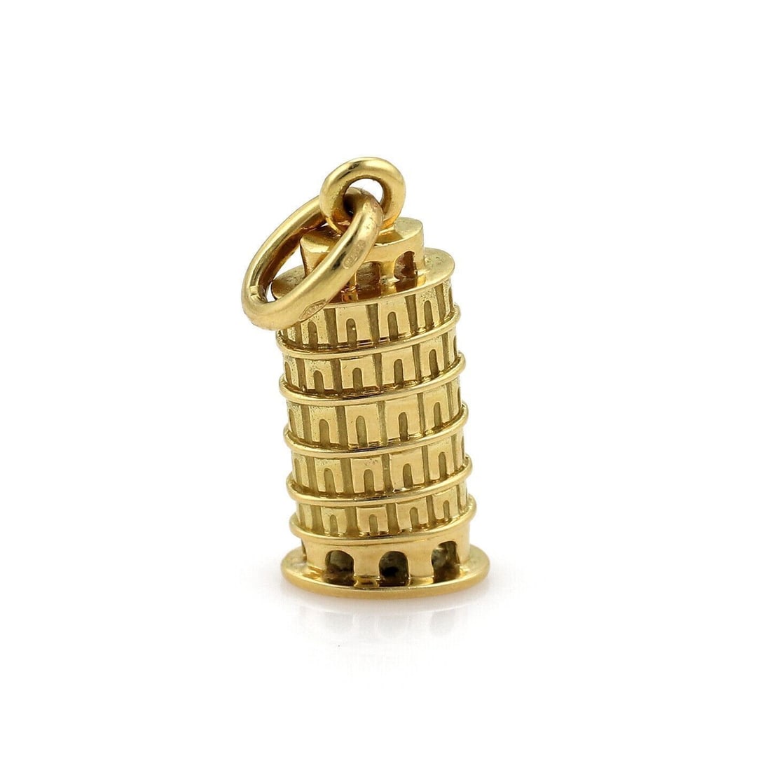 Pomellato 18k Yellow Gold Leaning Tower of Pisa Charm Pendant: Pomellato 18k Yellow Gold Leaning Tower of Pisa Charm Pendant A pre-owned Pomellato Leaning Pisa Tower charm pendant crafted in 18k yellow gold. This sculptural piece features a whimsical interpretati