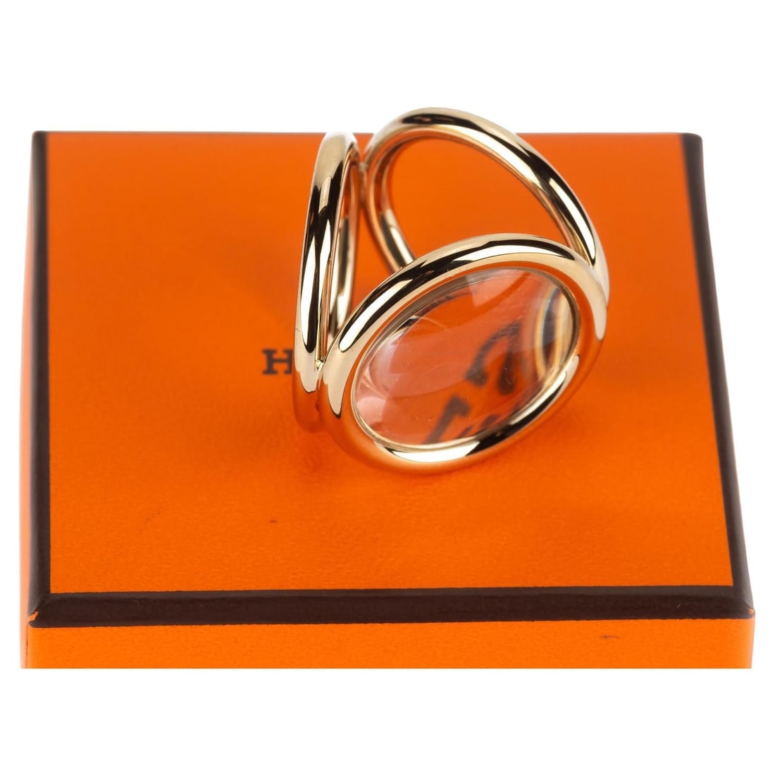 Hermes Anneau de Carre Trio Loop scarf ring permabrass: Hermes Anneau de Carre Trio Loop scarf ring permabrass Hermes Anneau de Carre Trio Loop scarf accessory in permabrass with a magnifying glass detail designed to slide onto a scarf. It comes with the b