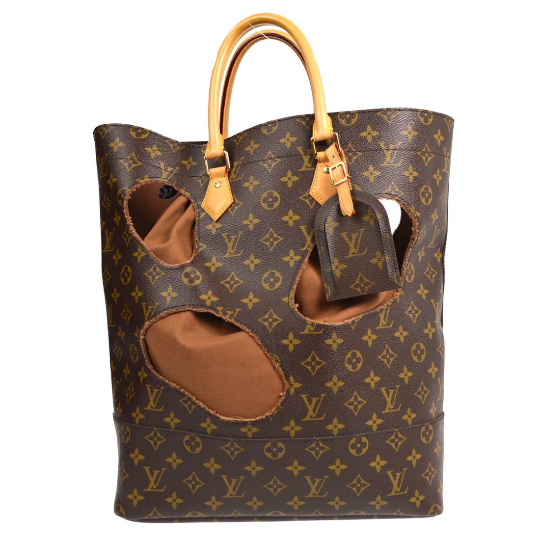 Louis Vuitton COMME des GARCONS Bag With Holes Monogram Tote M40279: Louis Vuitton COMME des GARCONS Bag With Holes Monogram Tote M40279 Louis Vuitton BAG WITH HOLES tote bag from the COMME des GARCONS collaboration in brown Monogram canvas and leather. This medium ope