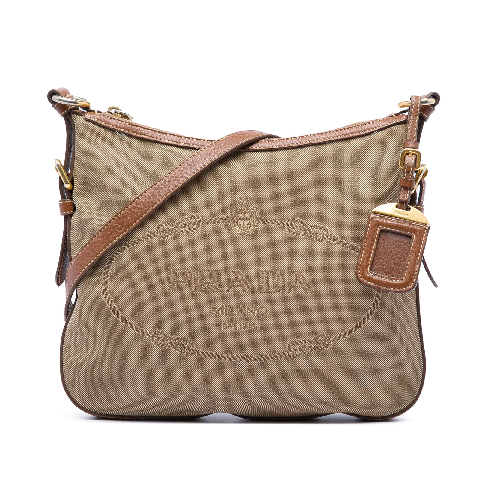 Prada Canapa Logo Canvas Crossbody Bag with Leather Trim: Prada Canapa Logo Canvas Crossbody Bag with Leather Trim Prada Canvas Canapa Logo Crossbody bag in beige fabric with leather trim. It features an adjustable flat leather shoulder strap, top zip closur
