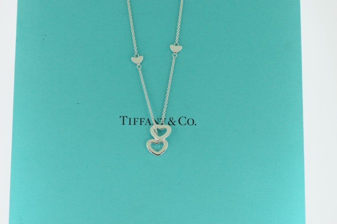 Tiffany & Co Open Heart Pendant Necklace in Sterling Silver 925: Tiffany & Co Open Heart Pendant Necklace in Sterling Silver 925 This exquisite Tiffany & Co. Open Heart Necklace is crafted from high-quality sterling silver (925), embodying a beautiful theme of love