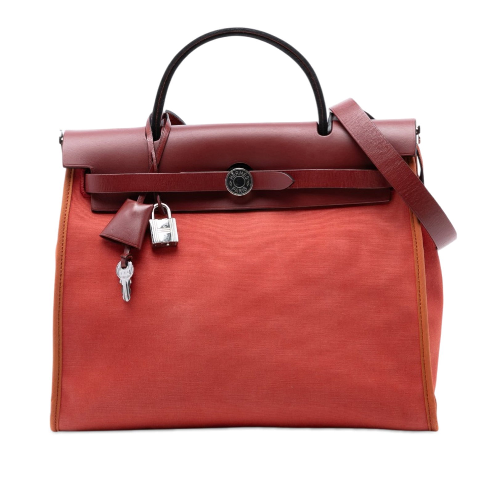 Herbag Zip 31 Orange Canvas and Leather Shoulder Bag by Hermes: Herbag Zip 31 Orange Canvas and Leather Shoulder Bag by Hermes The Hermes Toile Herbag Zip 31 is crafted with a canvas body and leather trim, featuring a flat leather top handle, a flat leather should