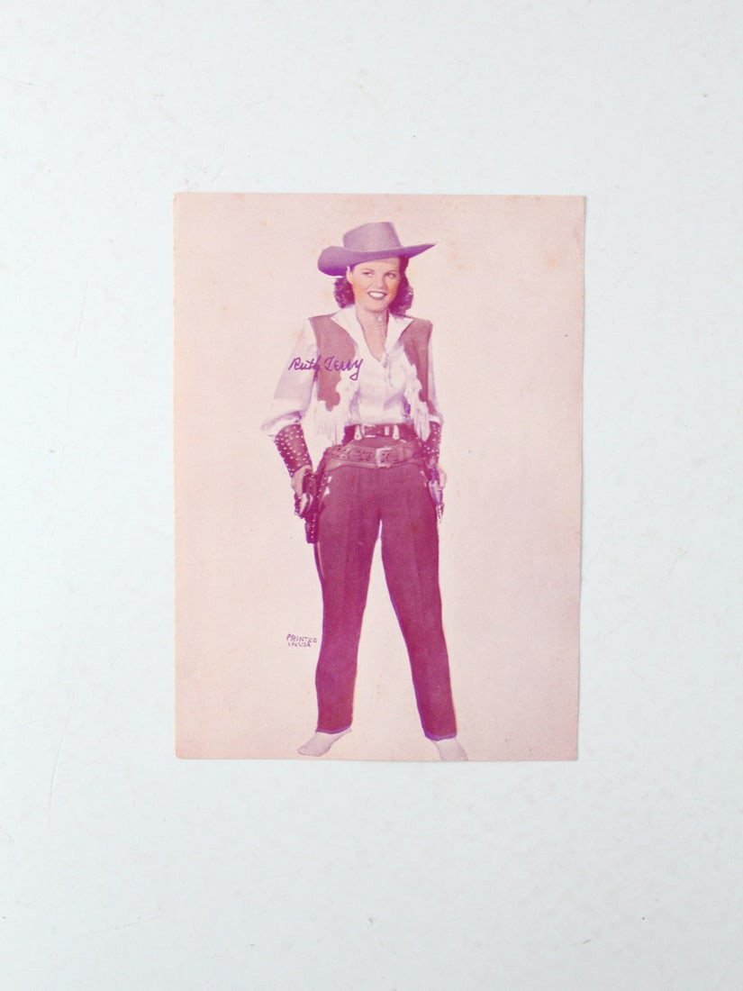 Ruth Terry 1943 Pistol Packin' Mama Vintage Movie Print: Ruth Terry 1943 Pistol Packin' Mama Vintage Movie Print This vintage promotional movie print features Ruth Terry from the 1943 film 'Pistol Packin' Mama.' The print showcases a color-tinted black and 