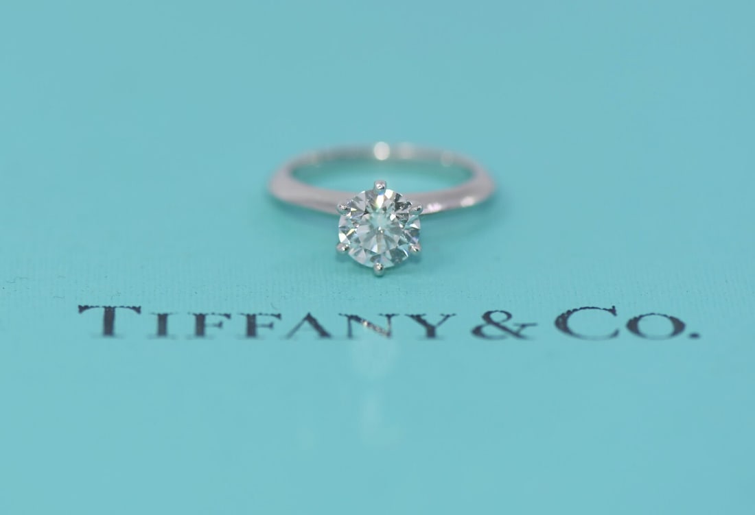 Tiffany & Co 1.03ct F/VVS1 Round Platinum Engagement Ring with Appraisal: Tiffany & Co 1.03ct F/VVS1 Round Platinum Engagement Ring with Appraisal This exquisite engagement ring from Tiffany & Co. features a stunning 1.03 carat round diamond, graded F/VVS1, set in luxurious