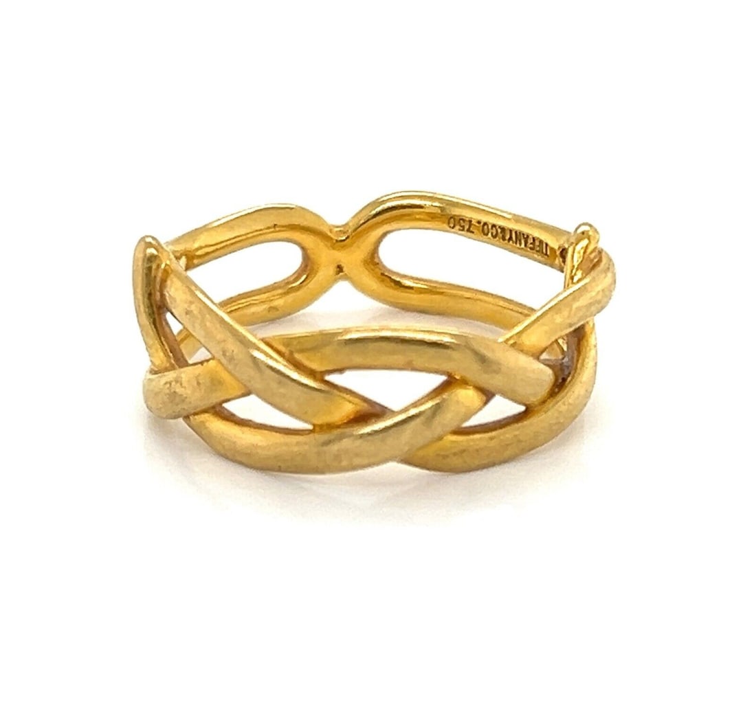 Tiffany & Co. Braided Band Ring 18k Yellow Gold Size 5: Tiffany & Co. Braided Band Ring 18k Yellow Gold Size 5 This Tiffany & Co. braided band ring is crafted in 18k yellow gold and features a textured braided design with a polished finish. It is a US size