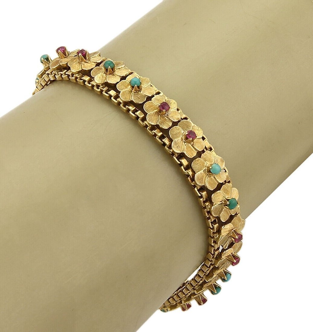 Vintage 18k Yellow Gold Floral Link Bracelet with Turquoise Ruby Green Onyx: Vintage 18k Yellow Gold Floral Link Bracelet with Turquoise Ruby Green Onyx This vintage estate floral link bracelet is crafted in solid 18k yellow gold and accented with turquoise, rubies, and green 