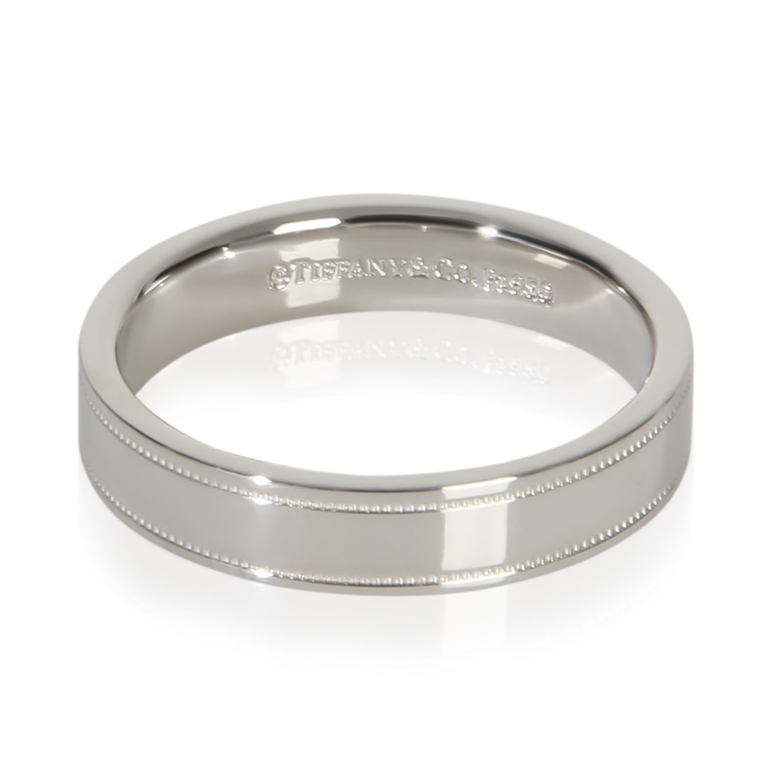 Tiffany & Co. Platinum Milgrain Band Ring Size 6.5: Tiffany & Co. Platinum Milgrain Band Ring Size 6.5 This Tiffany & Co. 4mm Milgrain band is crafted from platinum with a 950 purity and features a classic milgrain edge design. The ring is a women's si