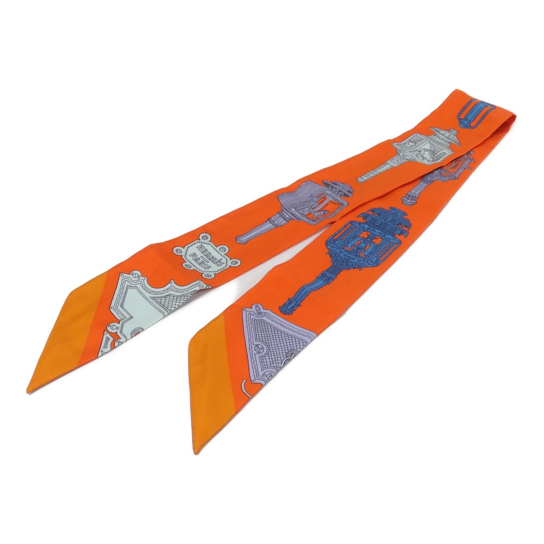 Hermes Twilly Silk Scarf Orange Made in France: Hermes Twilly Silk Scarf Orange Made in France Hermes Twilly scarf in orange silk, designed for women. It is a regular-size scarf made in France and measures 86 cm x 5 cm (33.9 x 2.0 in). Condition is