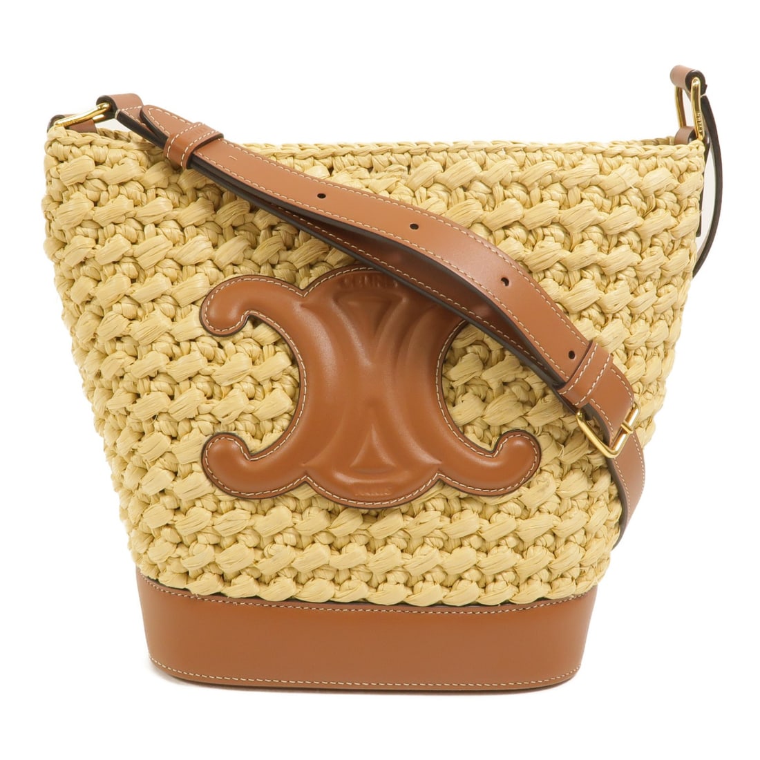 CELINE Cuir Triomphe Small Bucket Shoulder Bag Brown Raffia Calfskin: CELINE Cuir Triomphe Small Bucket Shoulder Bag Brown Raffia Calfskin A small bucket shoulder bag from CELINE in brown raffia and calfskin leather. It features a hook button closure and a shoulder stra