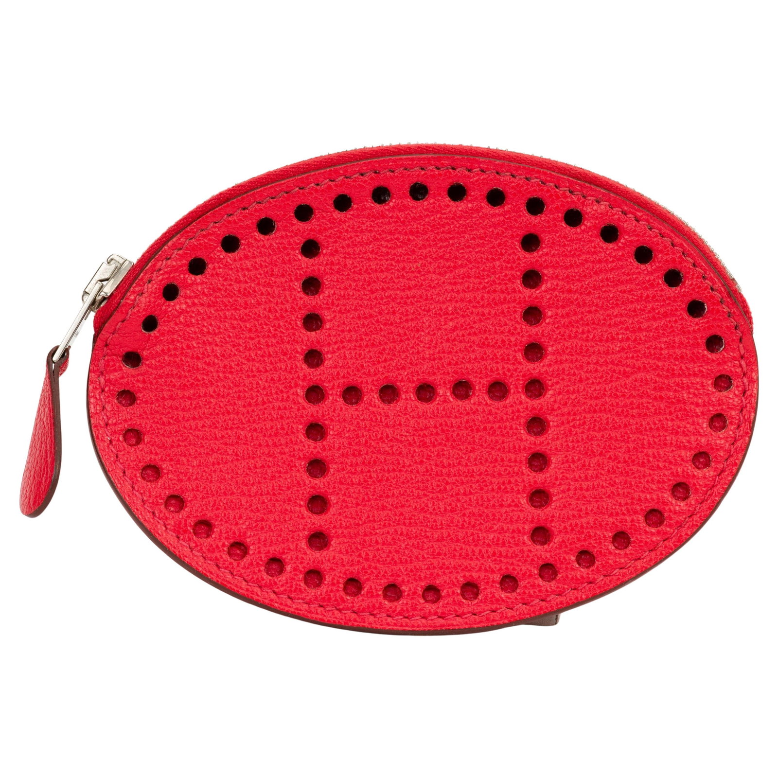 Hermes Evelyne Coral Red Chevre Goatskin Coin Purse with H Perforation: Hermes Evelyne Coral Red Chevre Goatskin Coin Purse with H Perforation Hermes Evelyne coin purse crafted from chevre goatskin leather in coral red. Features a frontal perforated Hermes H and a palladi