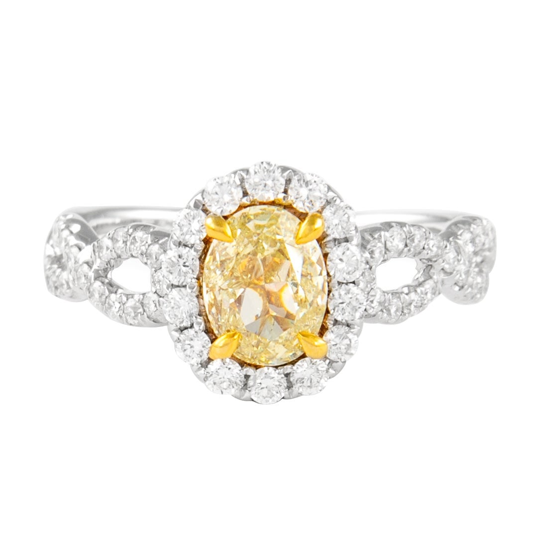 1.56ct Fancy Intense Yellow Diamond Halo Ring 18k: 1.56ct Fancy Intense Yellow Diamond Halo Ring 18k This exquisite ring showcases a stunning 1.56 carat total diamond weight, featuring a 1.00 carat oval cut Fancy Intense Yellow diamond with SI3 clarit