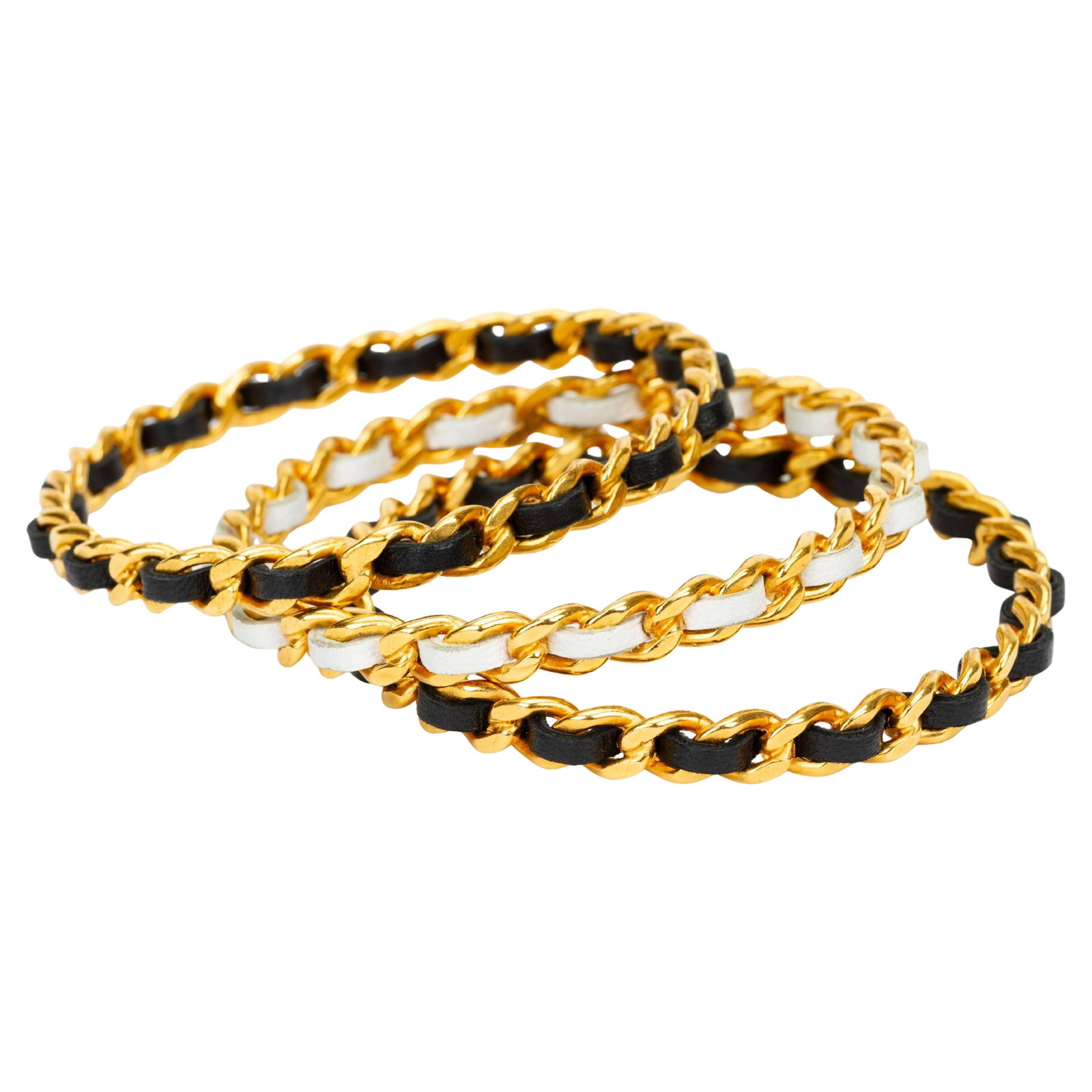Set of Three Chanel Gold Plated Leather and Chain Bangles: Set of Three Chanel Gold Plated Leather and Chain Bangles This set includes three Chanel bangles, each crafted in France from gold plated metal featuring woven leather and chain detailing. The bangles