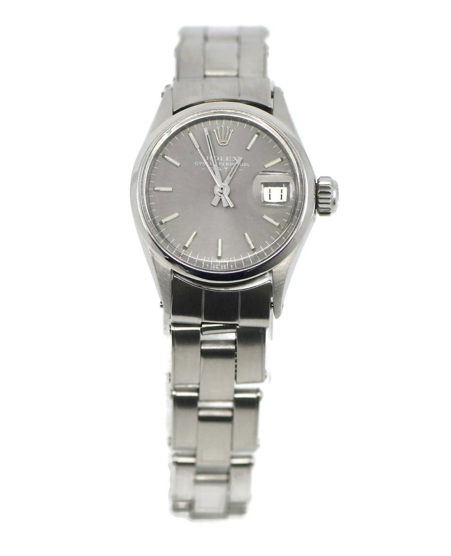 Rolex Oyster Perpetual Date 24 mm Stainless Steel Wristwatch: Rolex Oyster Perpetual Date 24 mm Stainless Steel Wristwatch This Rolex Oyster Perpetual Date wristwatch features a silver-tone stainless steel case and band with a polished finish. The round case mea