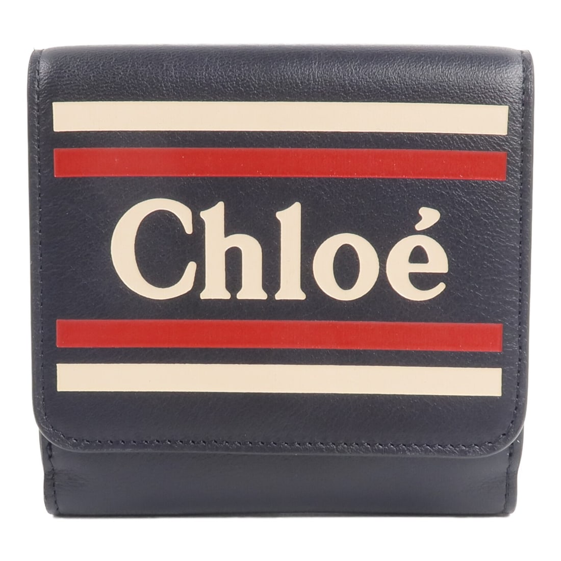 Chloe Vick bi-fold wallet in navy calfskin leather: Chloe Vick bi-fold wallet in navy calfskin leather A Chloe bi-fold wallet in navy calfskin leather, presented in very good AB condition. The design includes a hook button closure and an organized inte