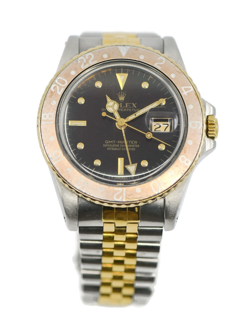 Rolex GMT-Master Ref 16753 18K and Stainless Steel Wristwatch: Rolex GMT-Master Ref 16753 18K and Stainless Steel Wristwatch Pre-owned Rolex GMT-Master wristwatch with automatic mechanical movement and analog display. This men's watch features a brown dial and co