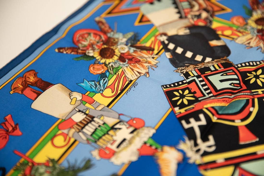 Hermes Kachinas Silk Scarf by Kermit Oliver 35x35 in Blue Turquoise: Hermes Kachinas Silk Scarf by Kermit Oliver 35x35 in Blue Turquoise This exquisite Hermes Silk Kachinas Scarf features a stunning design by artist Kermit Oliver. Crafted from luxurious silk twill, the