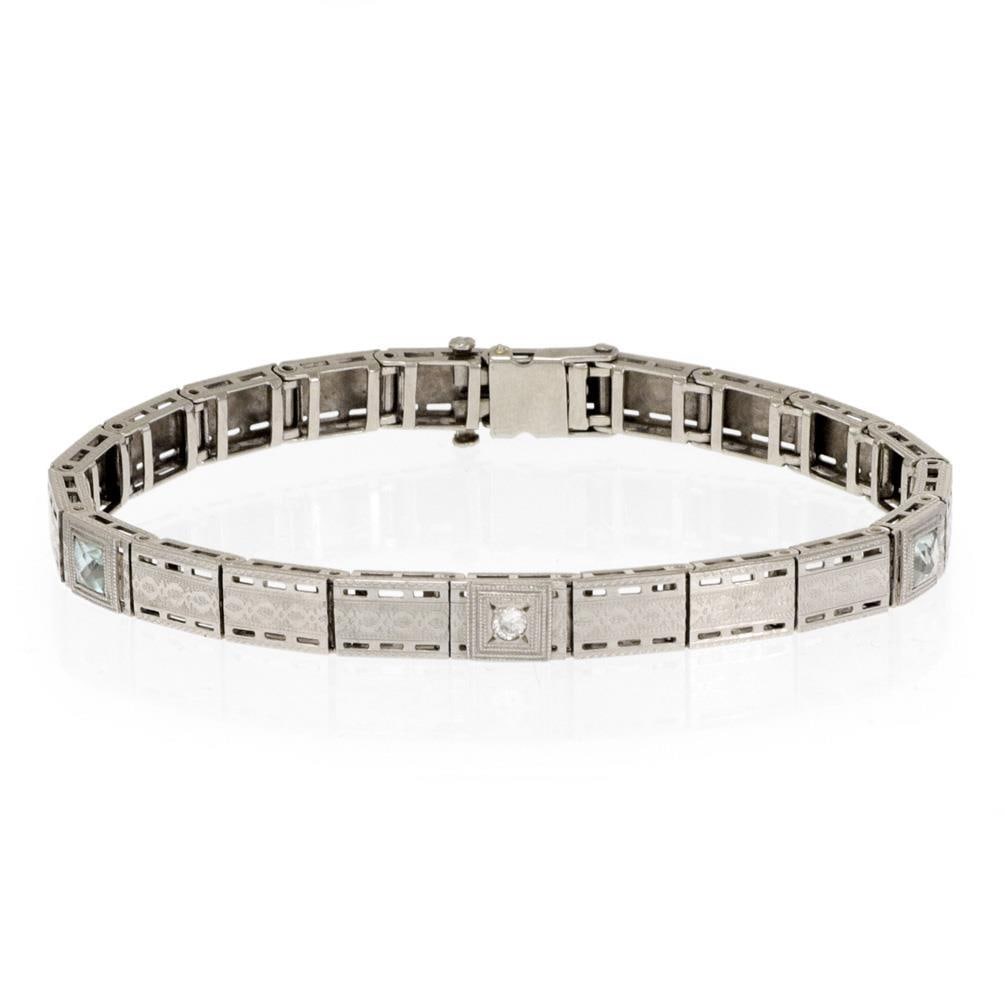 Art Deco Platinum 14k Gold Diamond Aquamarine Link Bracelet: Art Deco Platinum 14k Gold Diamond Aquamarine Link Bracelet This exquisite Art Deco bracelet features a stunning combination of platinum and 14k white gold. The design showcases a series of rectangle 
